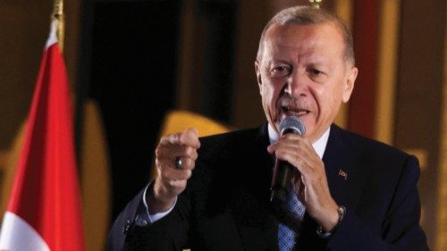Turkish President Tayyip Erdogan addresses his supporters following his victory in the second round ...