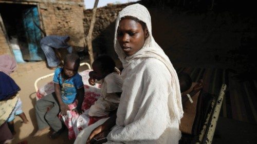 Islamie Mohamed,18, a Sudanese woman who fled the violence in Sudan's Darfur region, sits in the ...