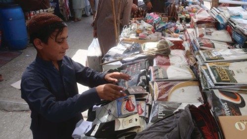 epa10685238 A Pakistani boy works at a roadside shop ahead of the World Day Against Child Labor in ...