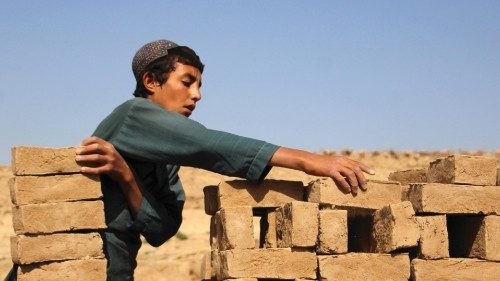 epa10686915 Aghi Ghul, Muhammad, a 13-years-old Afghan boy, works at a brick kiln to support his ...