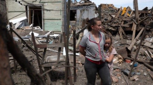 TOPSHOT - Residents survey the remains of their home in the aftermath of a Russian attack on ...