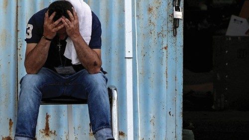 A migrant who was rescued at open sea off Greece along with other migrants, after their boat ... A migrant who was rescued at open sea off Greece along with other migrants, after their boat ...
