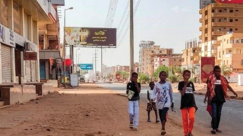 Children walk along the side of a street in the south of Khartoum on June 4, 2023. The United States ...
