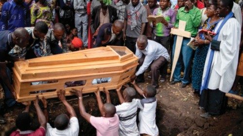 TOPSHOT - Mourners gather for funeral of Florence Masika and Zakayo Masereka during their burial ...