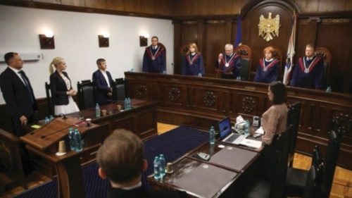 Head of Moldova's Constitutional Court Nicolae Rosca reads out the ruling during a hearing to verify ...