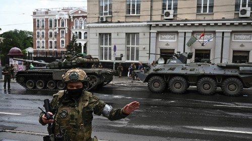 Fighters of Wagner private mercenary group are deployed in a street near the headquarters of the ...