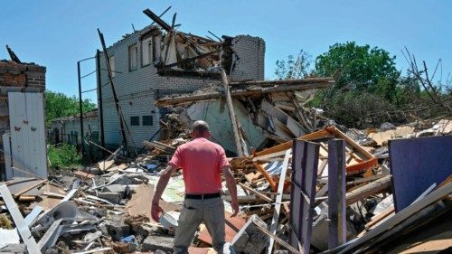 Oleksandr, 47, walks amongst the debris of his parents house, destroyed by a Russian missile attack, ...