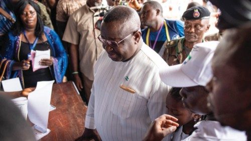 Incumbent President of Sierra Leone, Julius Maada Bio, registers to vote in Freetown on June 24, ...