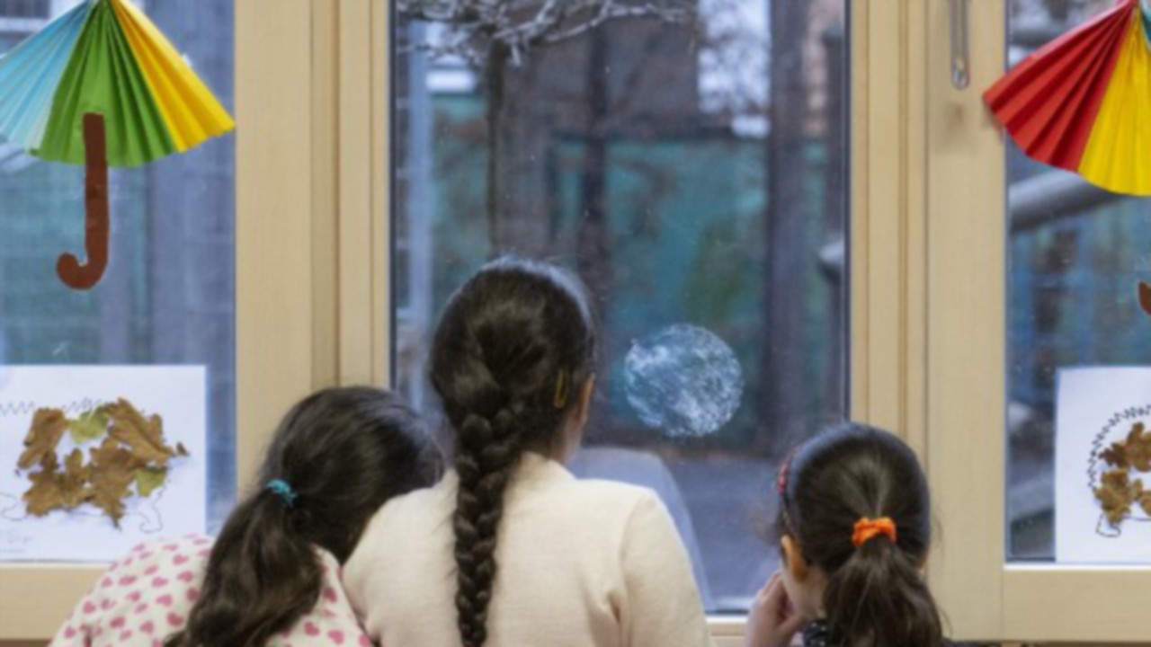 Girls take a brake during a special German language class for recently arrived migrant children at ...