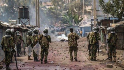 Riot police officers disperse supporters of Kenya's opposition leader Raila Odinga of the Azimio La ...