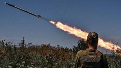 Ukrainian servicemen fire a Partyzan small multiple rocket launch system toward Russian troops near ...