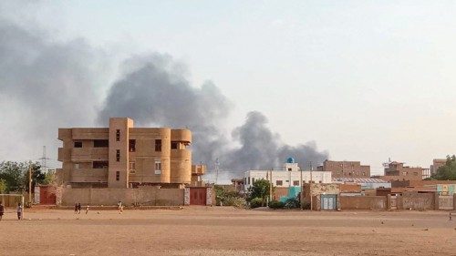 TOPSHOT - Smoke billows in the distance around the Khartoum Bahri district amid ongoing fighting on ...