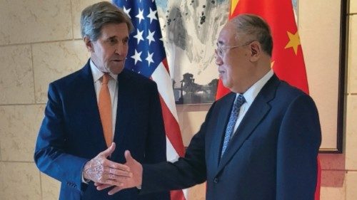 U.S. Special Presidential Envoy for Climate John Kerry shakes hands with his Chinese counterpart Xie ...