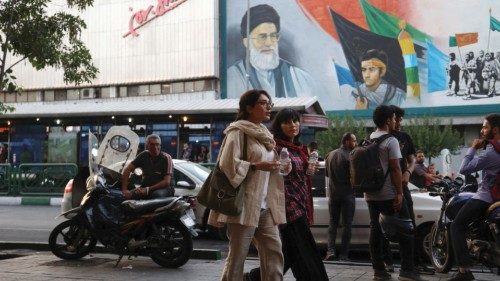 Iranian women walk on a street during the revival of morality police in Tehran, Iran, July 16, 2023. ...