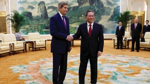 U.S. Special Presidential Envoy for Climate John Kerry and Chinese Premier Li Qiang shake hands ...