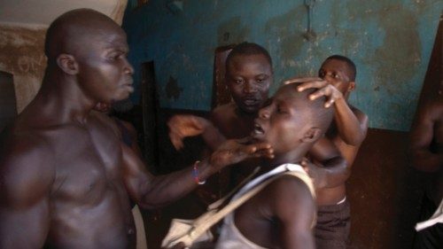 Ibrahim Sesay being interrogated by prisoners for the disappearance of a pair of slipper of a ... Ibrahim Sesay being interrogated by prisoners for the disappearance of a pair of slipper of a ...