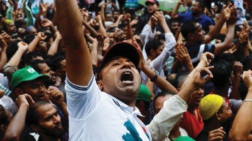 Supporters of Bangladesh Nationalist Party (BNP) chant slogan as they join in a rally to protest ...