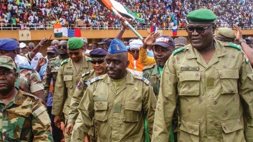 FILE PHOTO: Members of a military council that staged a coup in Niger attend a rally at a stadium in ...