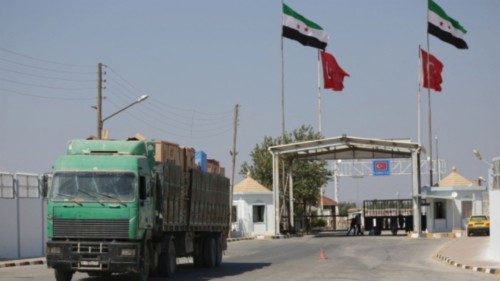FILE PHOTO: A Syrian truck carrying Turkish goods enters from Bab al Salam point near the city of ...