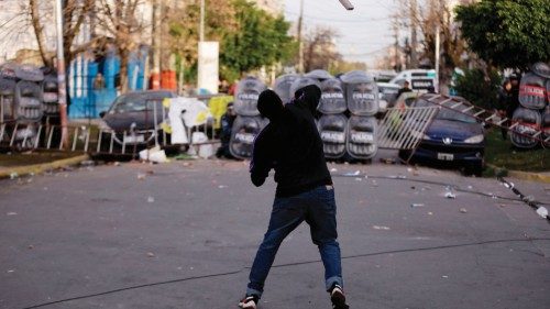A protester clashes with police during a demonstration held by residents of the Lanus municipality ... A protester clashes with police during a demonstration held by residents of the Lanus municipality ...