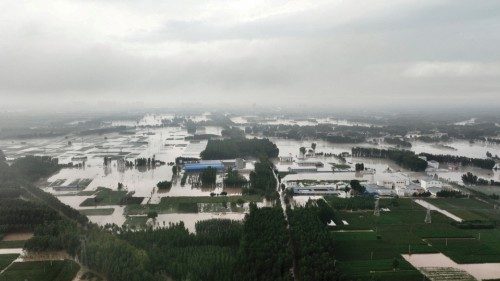 FILE PHOTO: An aerial view shows flooded farmlands and houses near Tazhao village, following heavy ...
