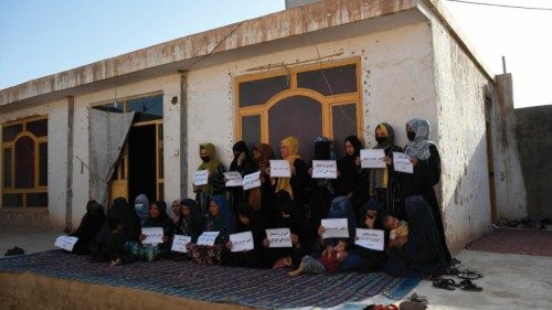 epaselect epa10803109 Afghan women hold placards reading in Dari 'A Muslim can't go against women's ...