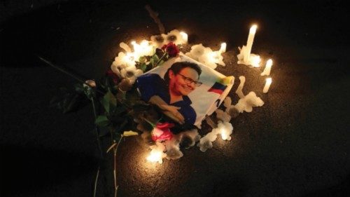 epa10805042 Supporters light candles around a photograph of the murdered Fernando Villavicencio, ...