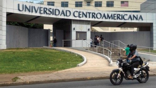 A motorcycle passes in front of the Universidad Centroamericana (Central American University) in ...