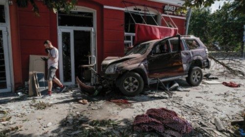 epa10807454 A crashed car at the site where a missile hit the Drama Theatre in central Chernihiv, ...