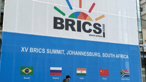 FILE PHOTO: A person walks past the Sandton Convention Centre, which will host the upcoming BRICS ...