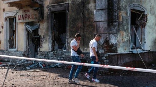 TOPSHOT - Law inforcement officers inspect the site of a missile strike in Chernihiv, on August 19, ...