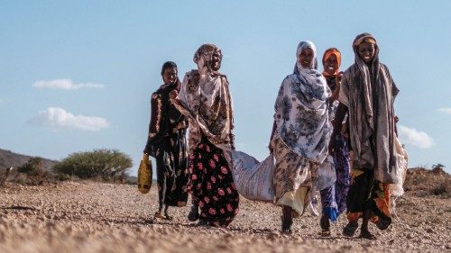 Internally displaced women walk at Berley Camp, 20 kilometres from the city of Gode, Ethiopia, on ...