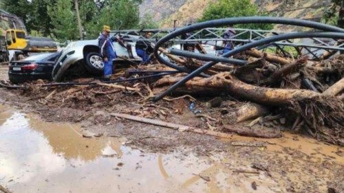 A views shows trapped cars on a road badly damaged by mudslide in the town of Vakhdat in Tajikistan, ...