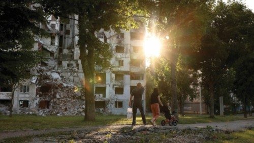 epa10831720 People walk past a damaged apartment block, previously hit by a Russian missile strike, ... epa10831720 People walk past a damaged apartment block, previously hit by a Russian missile strike, ...