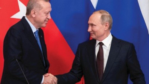 FILE PHOTO: Russian President Vladimir Putin and Turkish President Tayyip Erdogan shake hands during ...