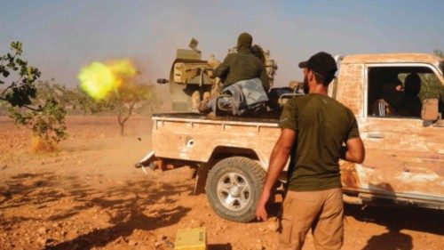 TOPSHOT - Turkey-backed fighters are positioned on the Mahsali and Arab Hasan frontline on the ...
