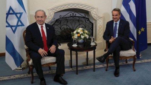 Greek Prime Minister Kyriakos Mitsotakis and Israeli Prime Minister Benjamin Netanyahu talk during a ...
