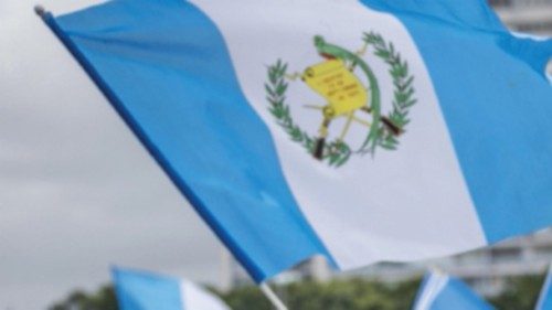 epa10836965 Demonstrators wave Guatemala national flags during a rally held to show their support ...