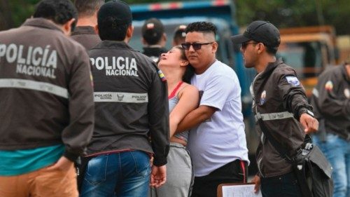 Relatives of slain Duran's councilman Bolivar Vera react after arriving to the place where his ...