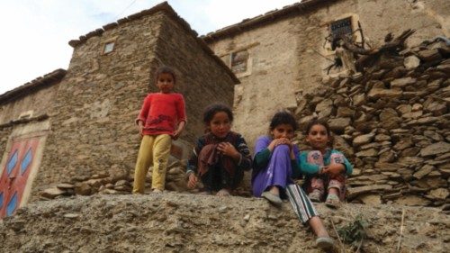 Children affected by a deadly earthquake stand outside a house, in the rural village of Azermoun, ... Children affected by a deadly earthquake stand outside a house, in the rural village of Azermoun, ...