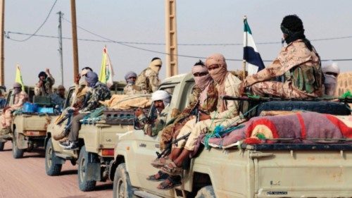 (FILES) Tuaregs fighters of the Coordination of Movements of the Azawad (CMA) drive near Kidal, ...