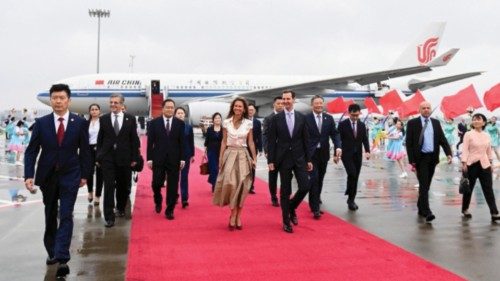 epa10873655 Syrian President Bashar al-Assad (5-R) and his spouse Asma al-Assad (5-L) arrive in ...