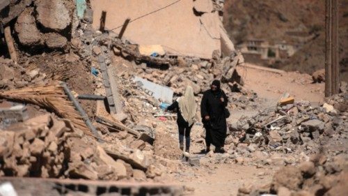 epaselect epa10872132 A woman walks through rubble in earthquake-hit village of Emi-Ntala, ... epaselect epa10872132 A woman walks through rubble in earthquake-hit village of Emi-Ntala, ...