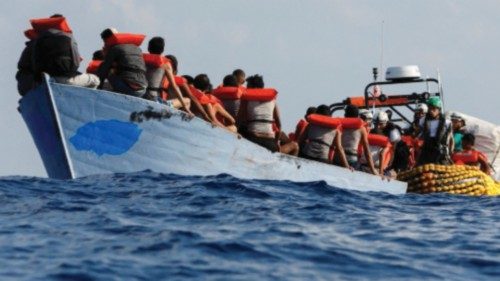 A group of 61 migrants on a wooden boat are rescued by crew members of the Geo Barents migrant ...