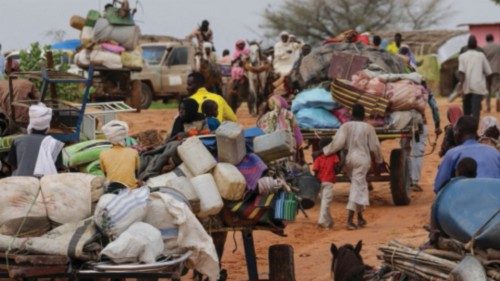 FILE PHOTO: Chadian cart owners transport belongings of Sudanese people who fled the conflict in ...