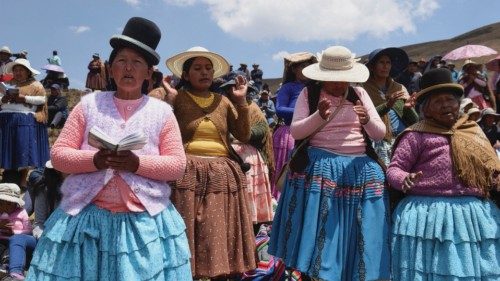 Indigenous women pray for rain near the Incachaca dam, in Incachaca, on the outskirts of La Paz, ...
