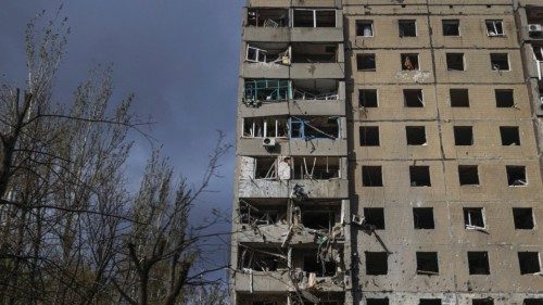 A view shows a damaged residential building, amid Russia's attack on Ukraine, in the town of ...