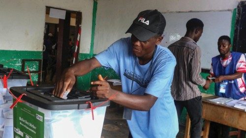 epa10912154 A man casts his vote during the presidential and general election  Oluremi Tunubu Public ...