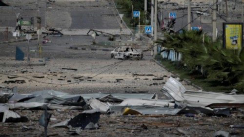 epaselect epa10940797 Debris in a deserted street following Israeli air strikes in Gaza City on 26 ...