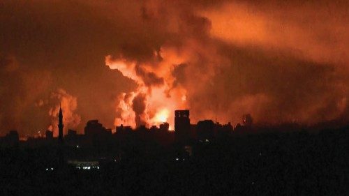This image grab from an AFP TV footage shows balls of fire rising above Gaza City during an Israeli ...